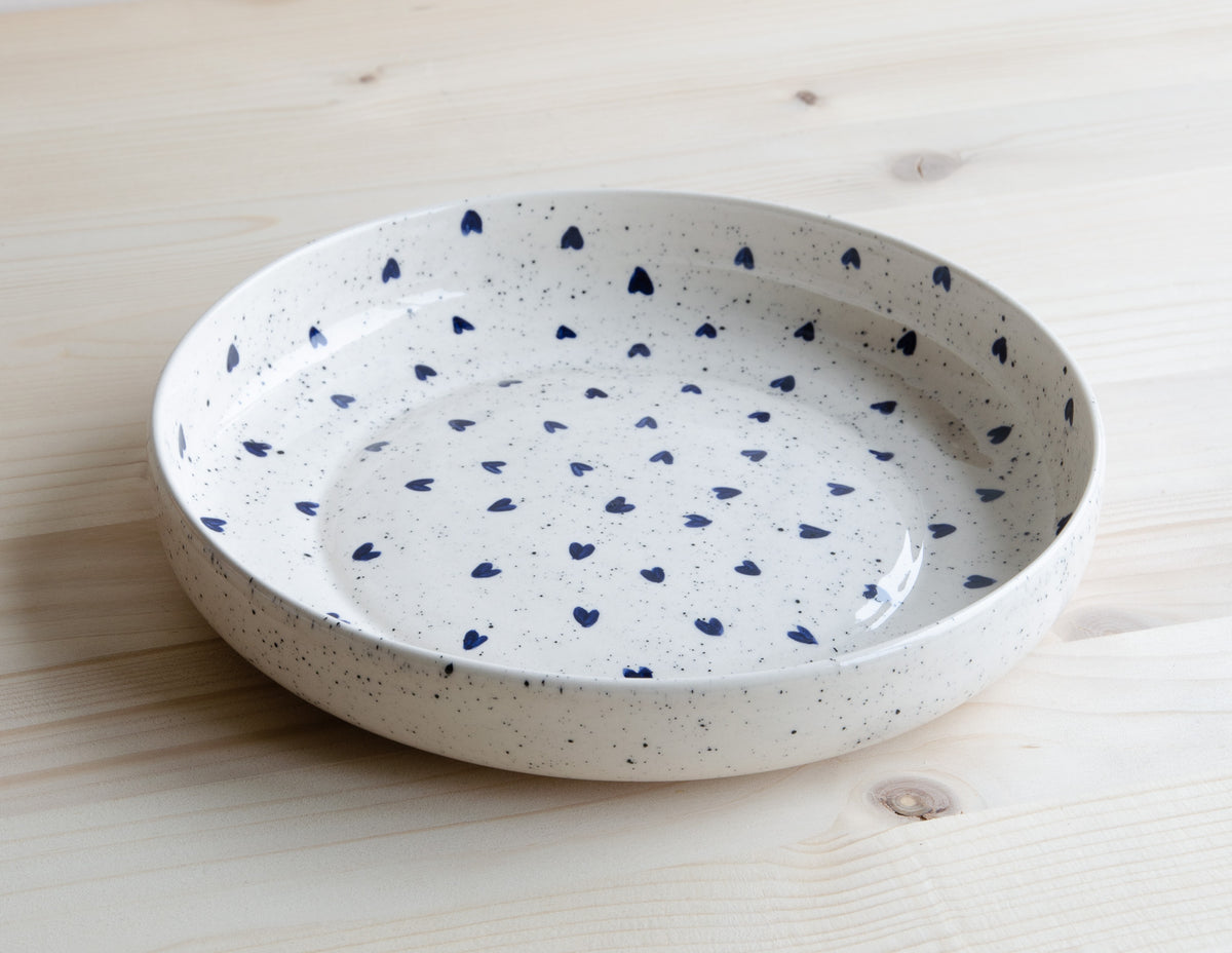 Deep plate with speckles and blue hearts