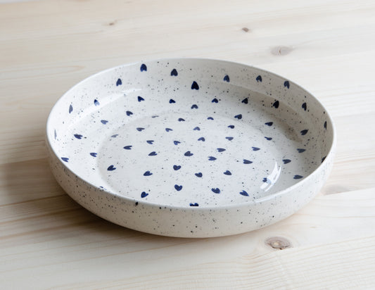 Deep plate with speckles and blue hearts