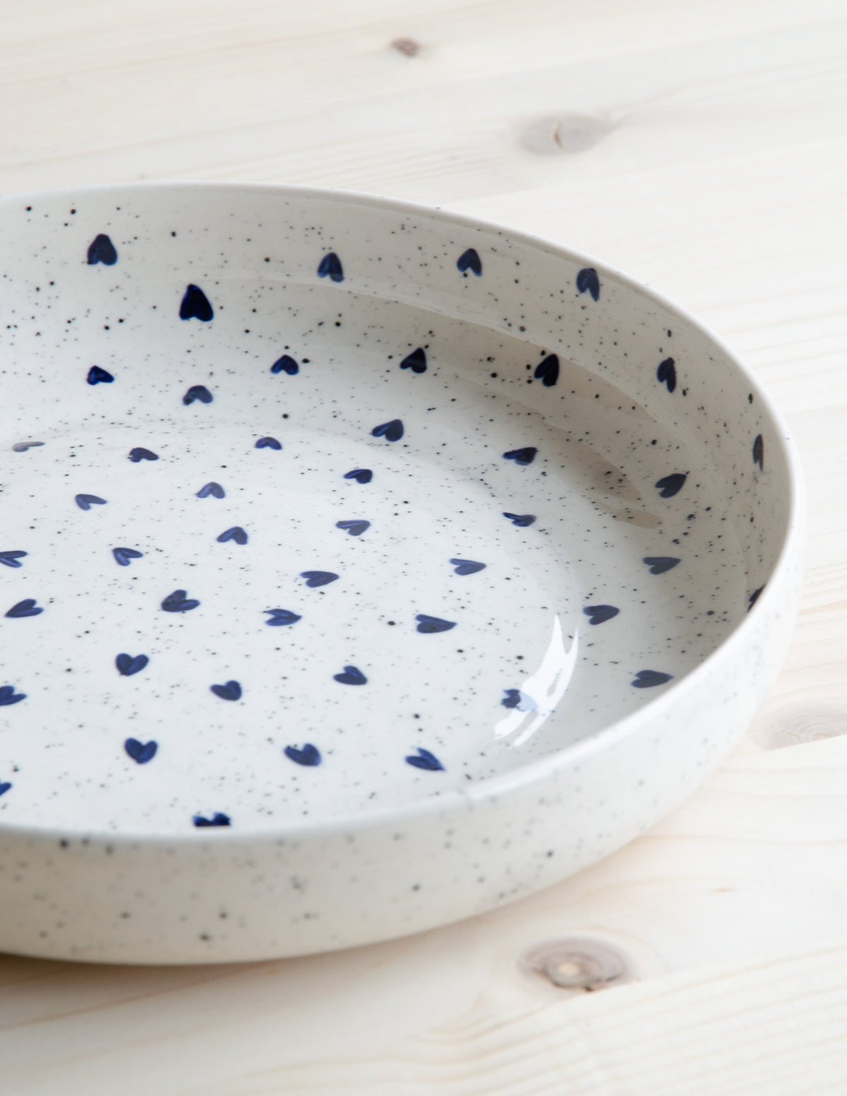 Deep plate with speckles and blue hearts