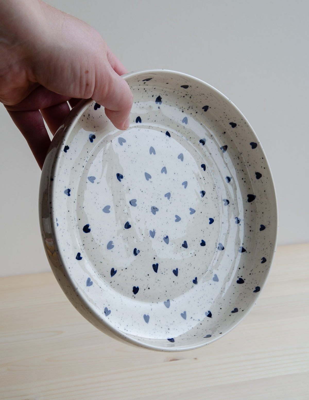 Deep plate with speckles and blue hearts