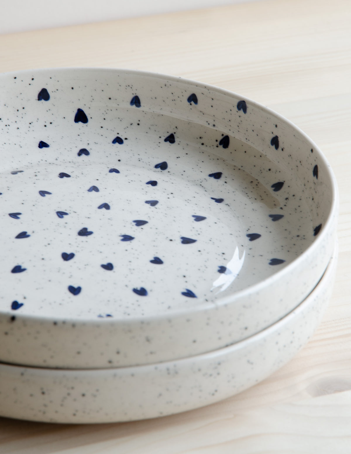 Deep plate with speckles and blue hearts